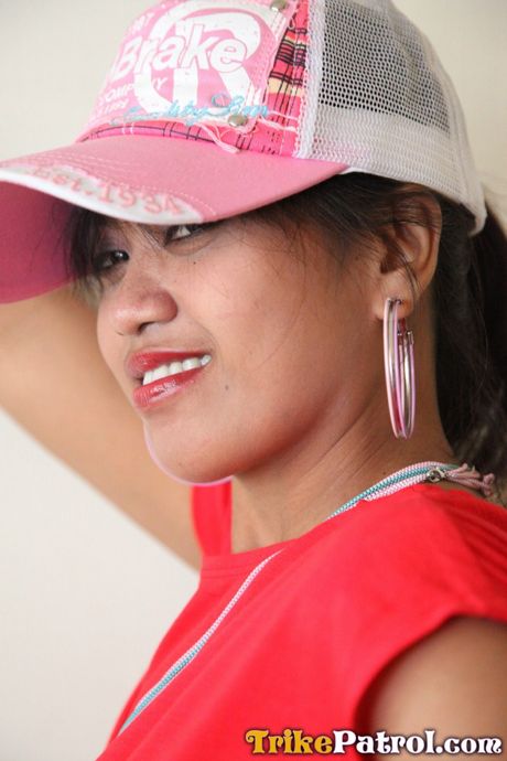 Asian teen Charm strips and shows her hot booty and tits in a solo